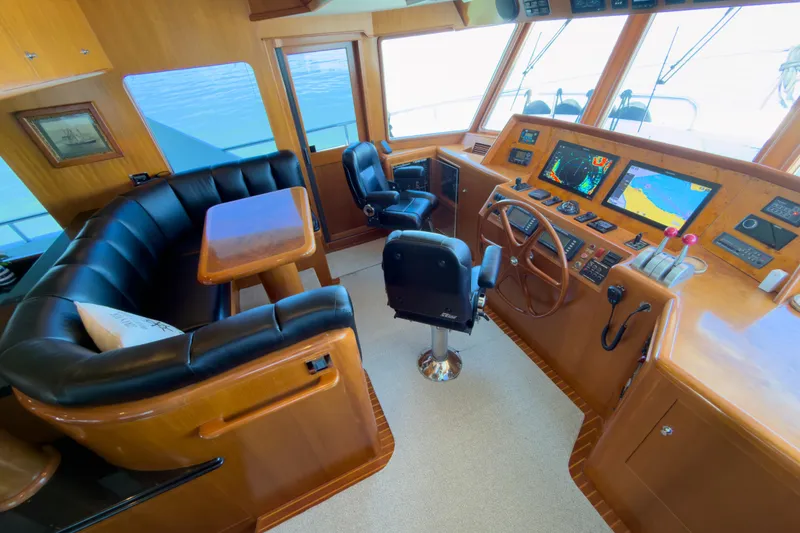 Slide: The Image of Luxurious helm of 2003 Ocean Alexander 700 Classicco yacht with navigation displays. - 19