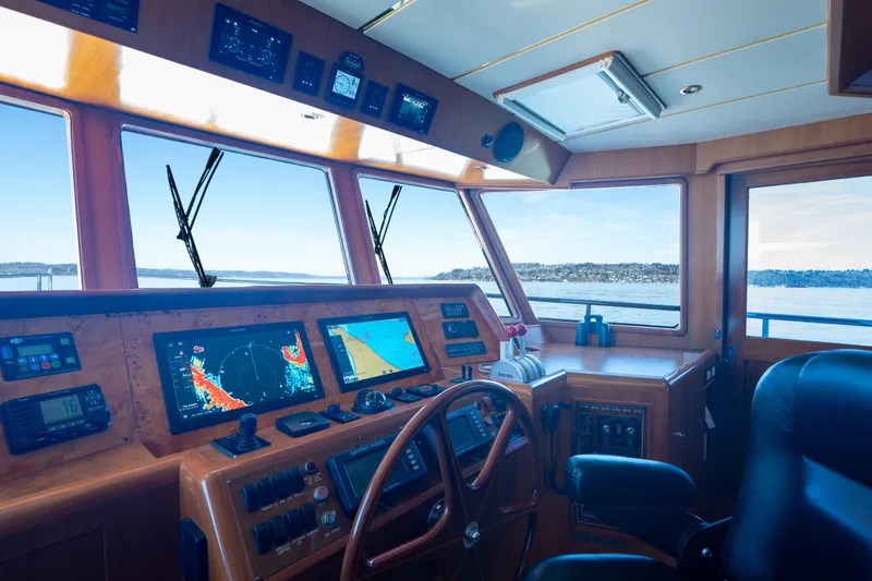 Slide: The Image of Cockpit of 2003 Ocean Alexander 700 Classicco yacht with navigation equipment and scenic view. - 20