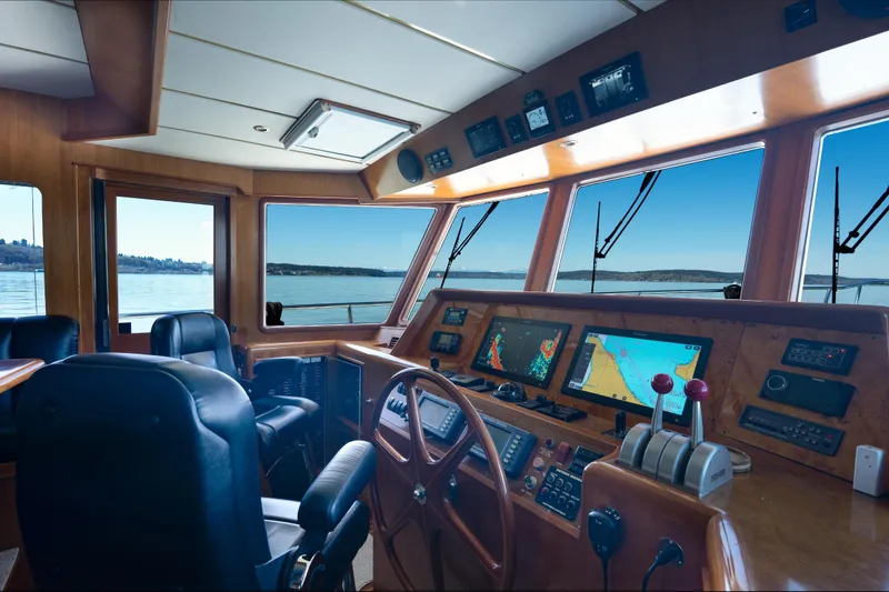 Slide: The Image of Cockpit of 2003 Ocean Alexander 700 Classicco yacht with navigation equipment and scenic view. - 21