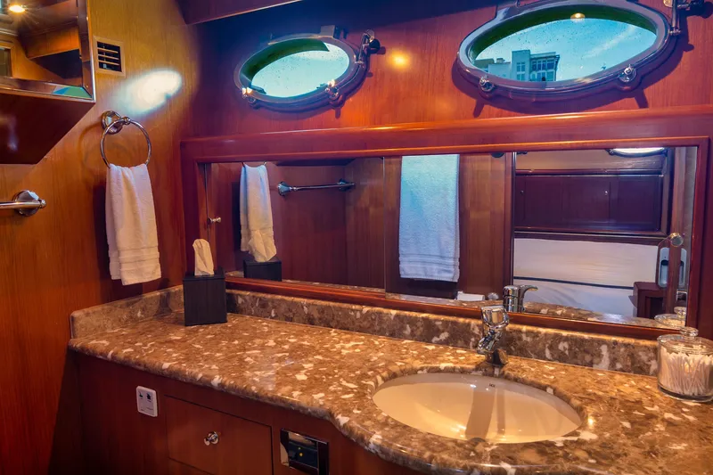 Slide: The Image of Luxurious bathroom interior of 2003 Ocean Alexander 700 Classicco yacht with marble countertop. - 29