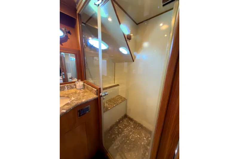 Slide: The Image of Luxurious bathroom interior of 2003 Ocean Alexander 700 Classicco yacht with marble accents. - 31