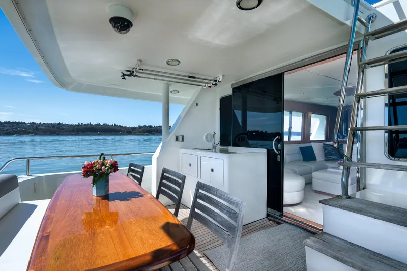 Slide: The Image of Luxurious 2003 Ocean Alexander 700 Classicco yacht with elegant outdoor dining area and scenic views. - 37