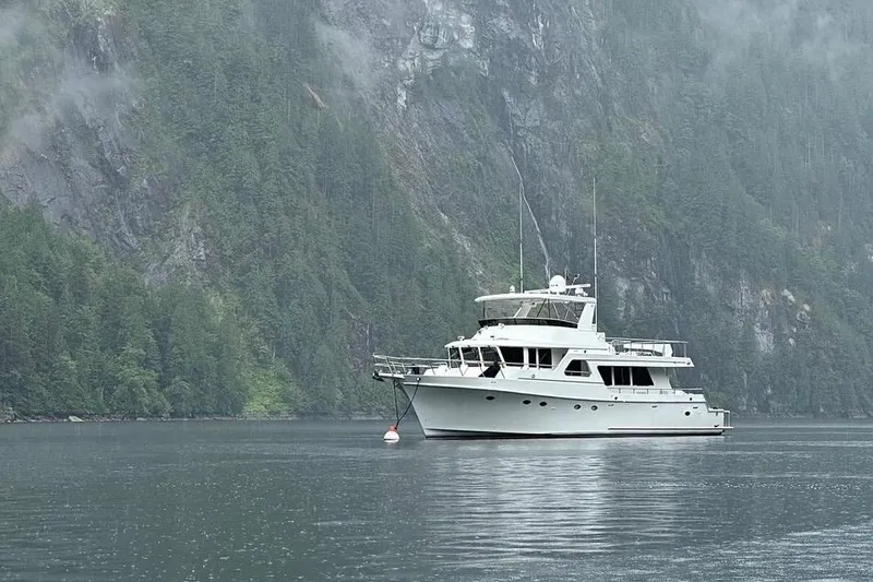 Slide: The Image of 2003 Ocean Alexander 700 Classicco yacht cruising on calm waters. - 4