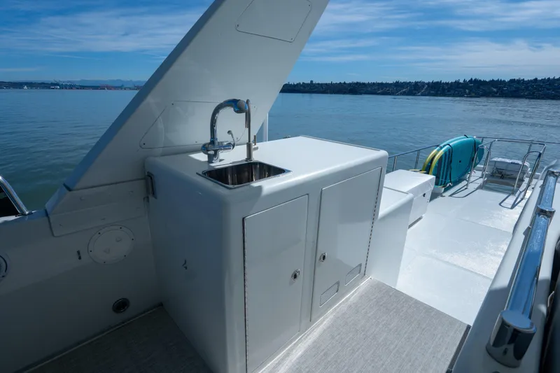 Slide: The Image of 2003 Ocean Alexander 700 Classicco yacht deck with sink and ocean view. - 45