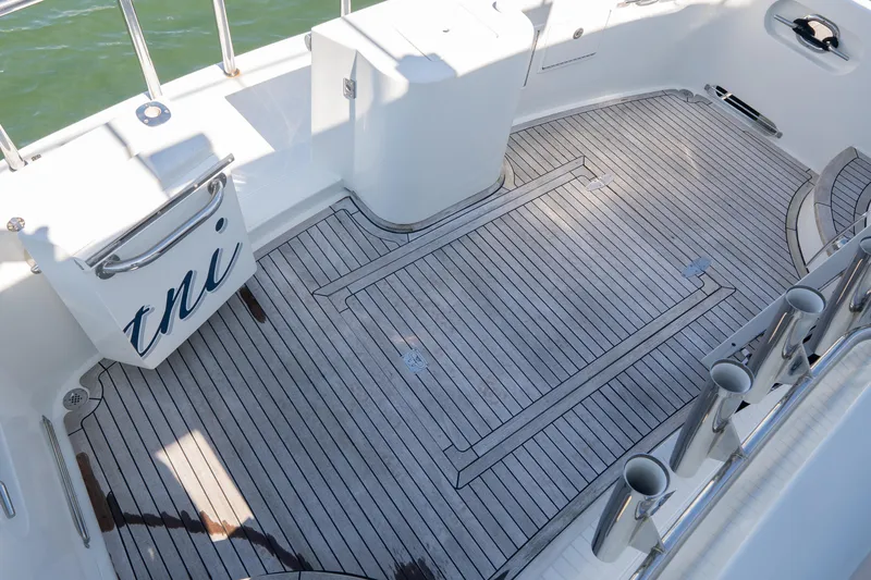 Slide: The Image of Teak deck of 2003 Ocean Alexander 700 Classicco yacht, featuring sleek design and stainless steel railings. - 49