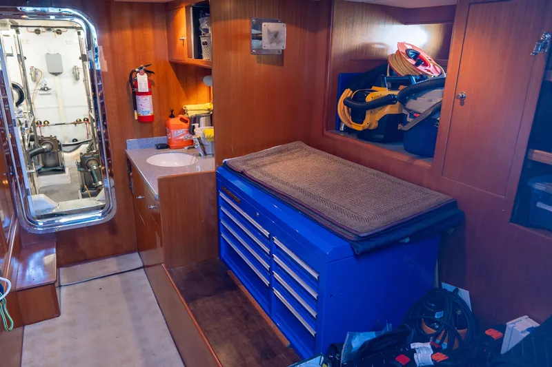 Slide: The Image of Engine room of 2003 Ocean Alexander 700 Classicco yacht with tools and equipment. - 56