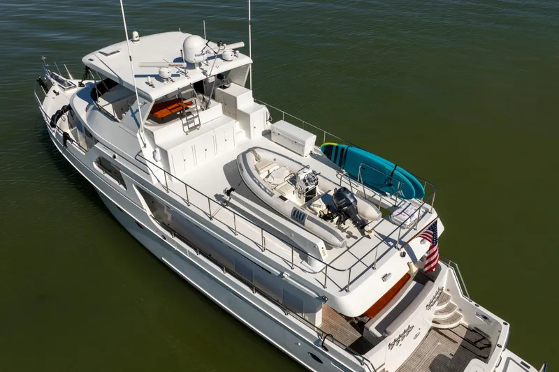 Slide: The Image of 2003 Ocean Alexander 700 Classicco yacht with tender and paddleboard on deck. - 65