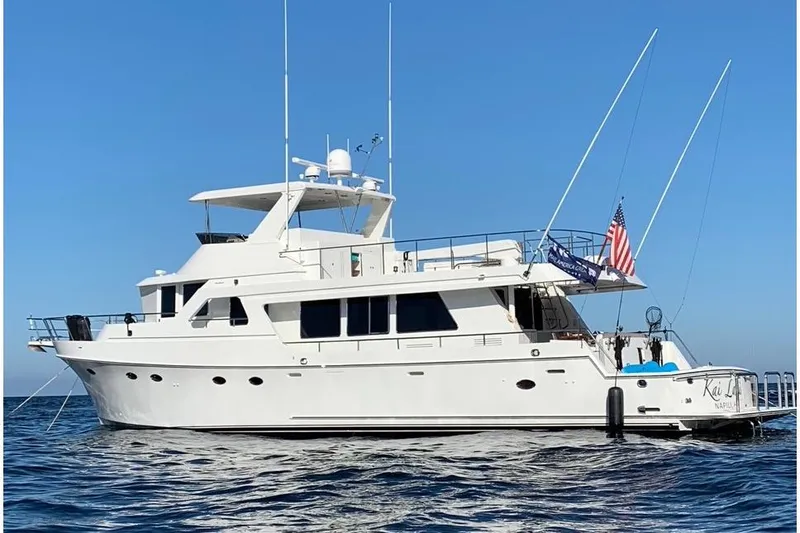Slide: The Image of 2003 Ocean Alexander 700 Classicco yacht on open water, clear blue sky. - 68
