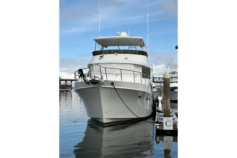 Slide: The Image of 2003 Ocean Alexander 700 Classicco yacht anchored in scenic coastal waters. - 7