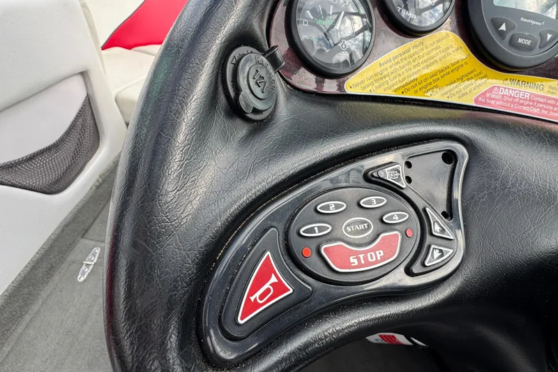 Slide: The Image of Steering wheel controls of 2000 Correct Craft Super Air Nautique boat. - 14
