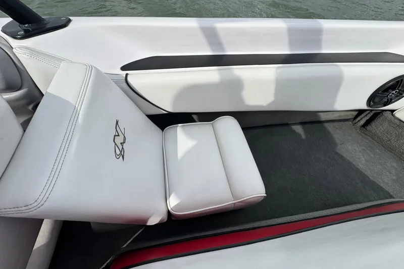 Slide: The Image of Interior of 2000 Correct Craft Super Air Nautique boat with white seating. - 18