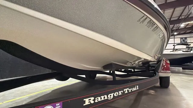 Slide: The Image of 2015 Ranger Z118C boat on Ranger Trail trailer in warehouse. - 10