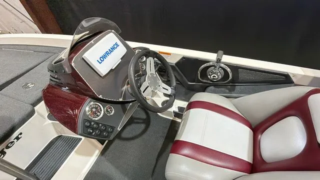 Slide: The Image of Interior of 2015 Ranger Z118C boat with steering wheel and Lowrance display. - 13