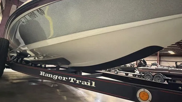 Slide: The Image of 2015 Ranger Z118C boat on Ranger Trail trailer in warehouse. - 9