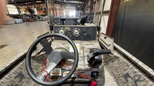 Slide: The Image of Interior view of a 2014 Xpress XP18CC boat with controls. - 12