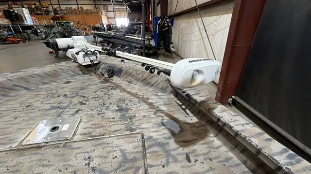 Slide: The Image of Interior view of a 2014 Xpress XP18CC boat in a workshop. - 15