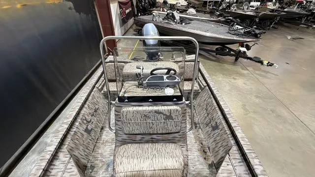 Slide: The Image of 2014 Xpress XP18CC boat with Yamaha 90 engine in warehouse. - 17