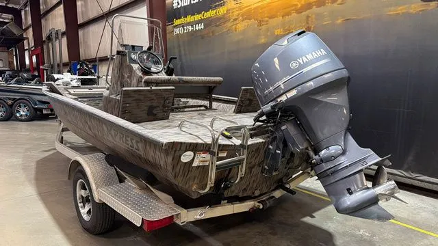 Slide: The Image of 2014 Xpress XP18CC boat with Yamaha 90 engine in warehouse. - 3