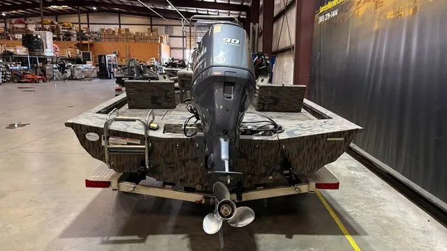 Slide: The Image of 2014 Xpress XP18CC boat with Yamaha 90 engine in warehouse. - 4