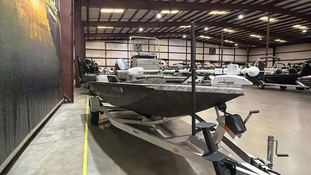 Slide: The Image of 2014 Xpress XP18CC boat with Yamaha 90 engine in warehouse. - 7