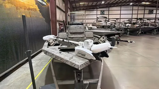 Slide: The Image of 2014 Xpress XP18CC boat with Yamaha 90 motor in warehouse. - 8