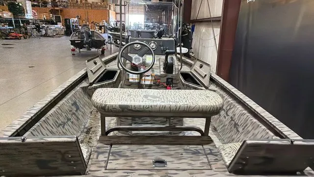 Slide: The Image of Interior view of a 2014 Xpress XP18CC boat with Yamaha 90. - 9