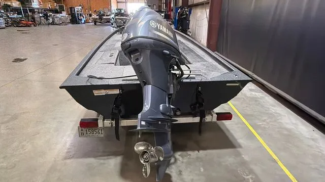 Slide: The Image of 2015 Xpress XP16PF boat with Yamaha 40 engine in warehouse. - 4