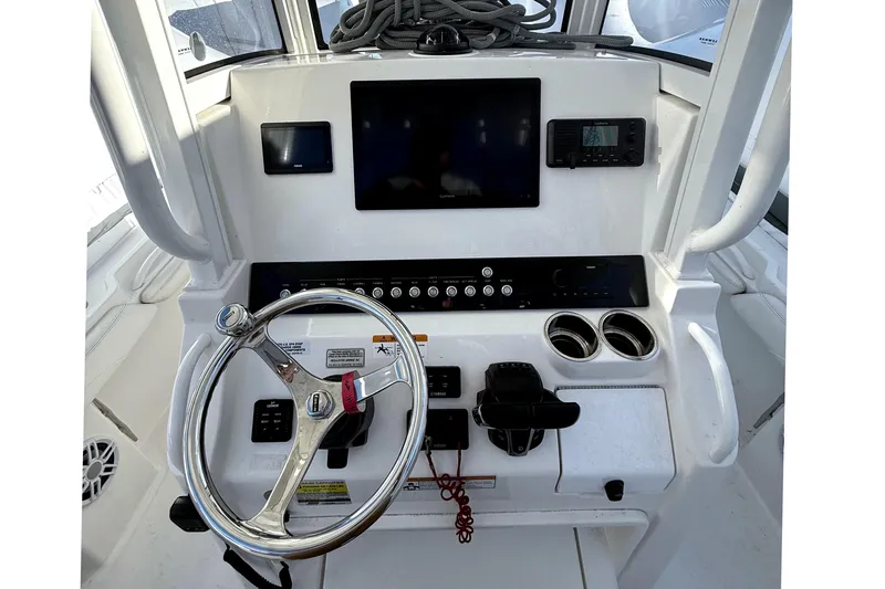 Slide: The Image of 2022 Regulator 23 boat helm with modern electronics. - 11