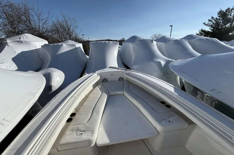 Slide: The Image of 2022 Regulator 23 boat surrounded by covered boats. - 6