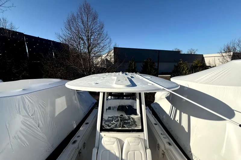 Slide: The Image of 2022 Regulator 23 boat stored between covers. - 7