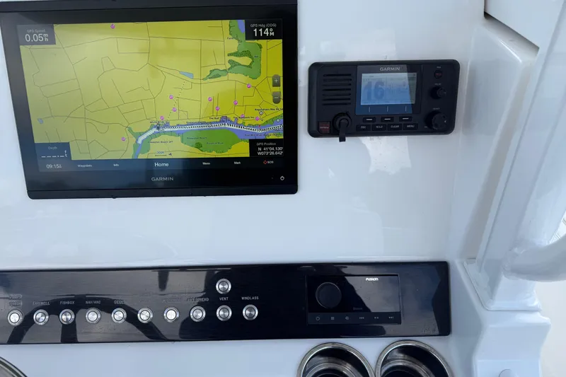 Slide: The Image of Dashboard of a 2022 Regulator 23 boat featuring Garmin navigation and control systems. - 9