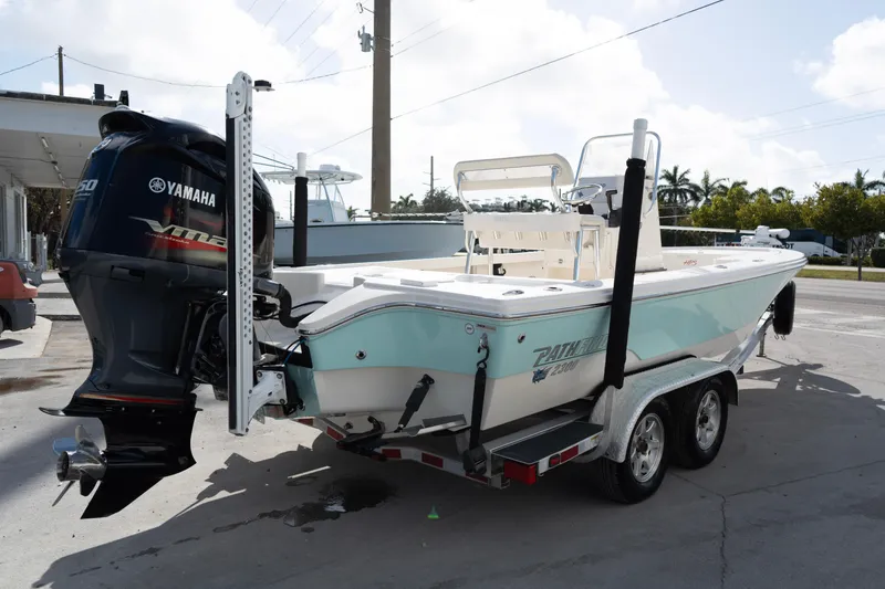 Slide: The Image of 2014 Pathfinder 2300 HPS boat on trailer with Yamaha outboard motor. - 4