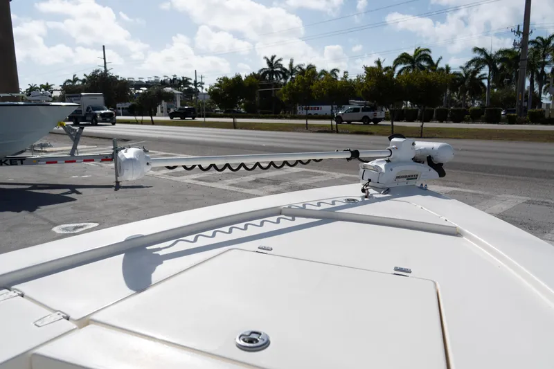 Slide: The Image of 2014 Pathfinder 2300 HPS boat with Minn Kota trolling motor, parked near a road. - 5