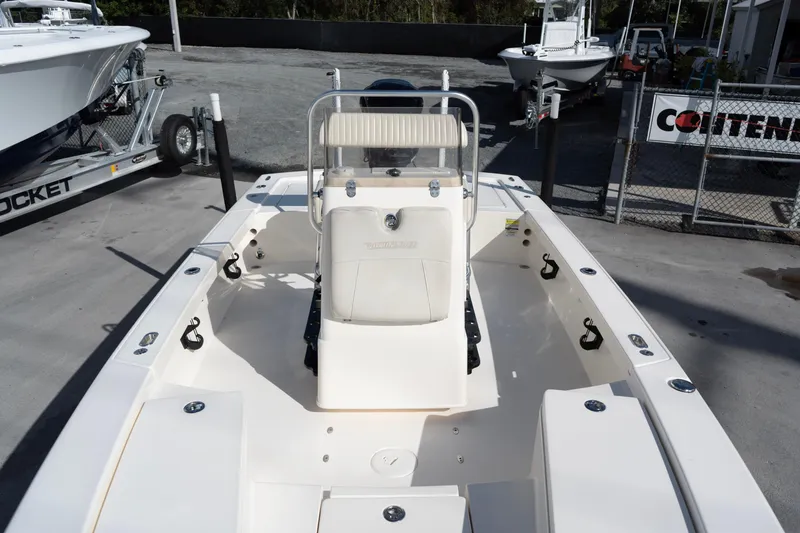Slide: The Image of 2014 Pathfinder 2300 HPS boat on display at a dealership. - 6