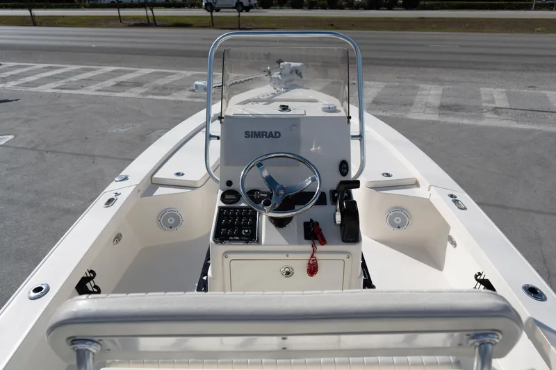 Slide: The Image of 2014 Pathfinder 2300 HPS boat interior with steering console and Simrad electronics. - 8