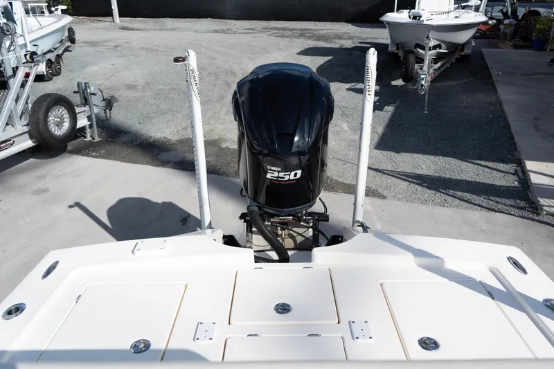 Slide: The Image of 2014 Pathfinder 2300 HPS boat with Yamaha 250 engine, parked on concrete. - 9