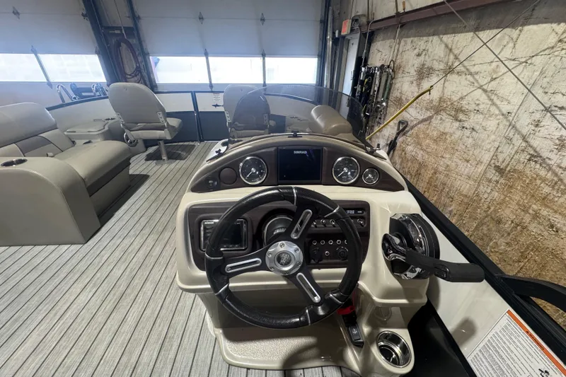 Slide: The Image of 2018 Trifecta SS 21FC boat interior with steering console and seating. - 12