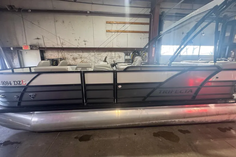 Slide: The Image of 2018 Trifecta SS 21FC pontoon boat in a warehouse setting. - 3