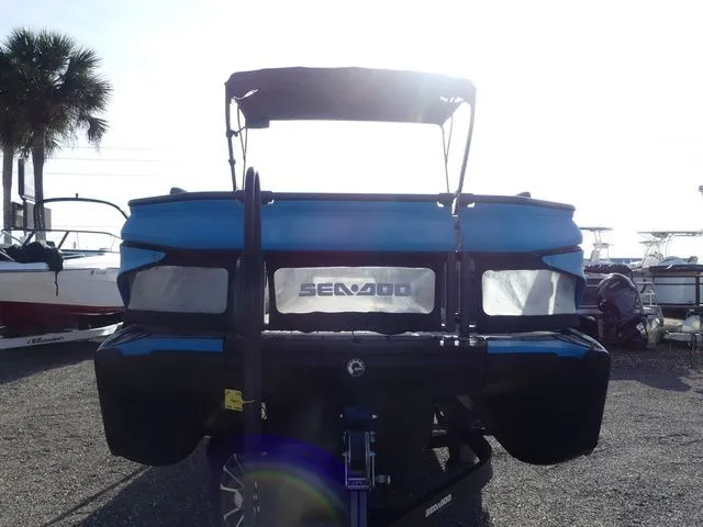 Slide: The Image of 2022 Sea-Doo Switch Cruise 21 boat at dock, rear view. - 2