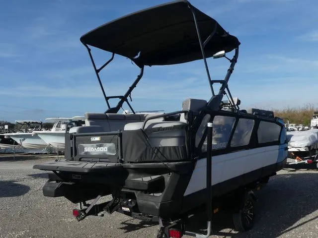 Slide: The Image of 2022 Sea-Doo Switch Cruise 21 pontoon boat on a trailer. - 4