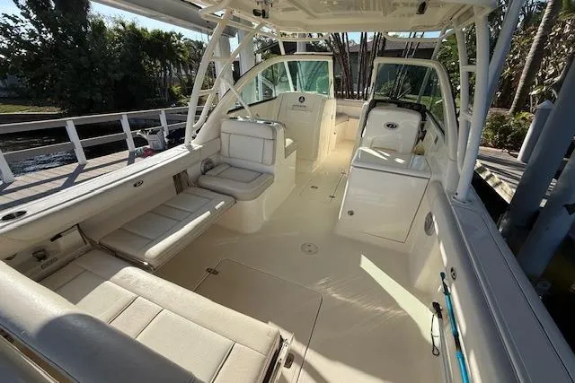 Slide: The Image of 2011 Pursuit DC 265 Dual Console boat interior with spacious seating and sleek design. - 10