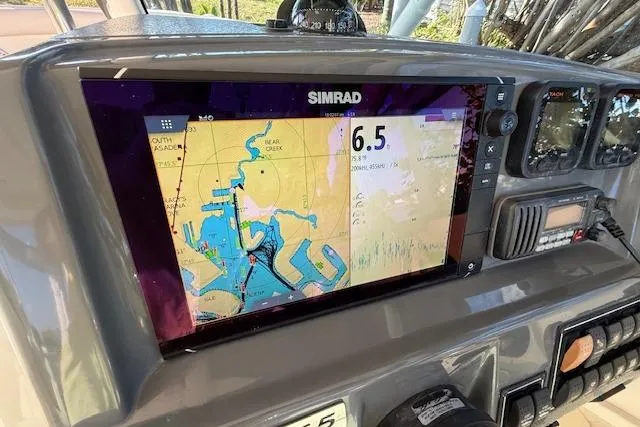 Slide: The Image of Simrad navigation display on 2011 Pursuit DC 265 Dual Console boat dashboard. - 29