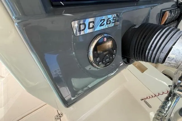 Slide: The Image of Control panel of a 2011 Pursuit DC 265 Dual Console boat. - 34