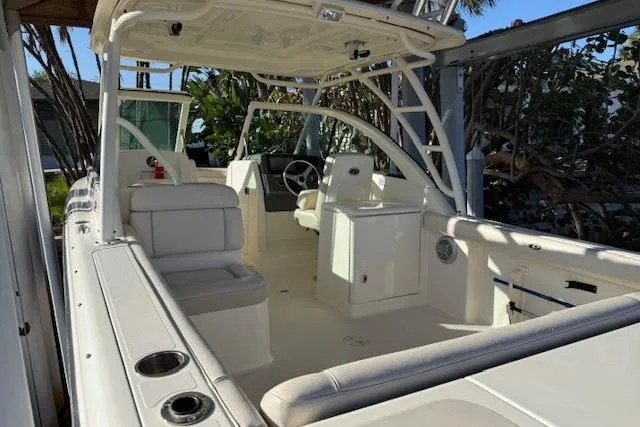 Slide: The Image of 2011 Pursuit DC 265 Dual Console boat interior with seating and steering wheel. - 7
