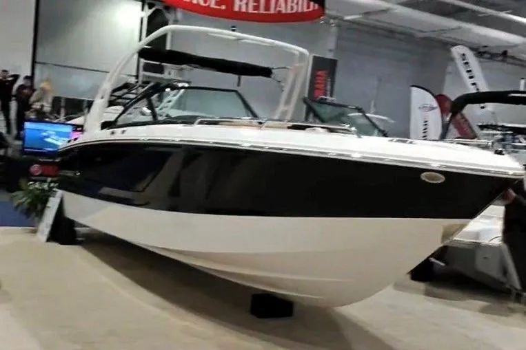 The Image of 2026 Chaparral SSX 4 boat displayed at an indoor exhibition. - 1