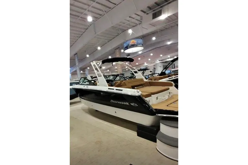 Slide: The Image of 2026 Chaparral SSX 4 boat displayed in a showroom, featuring sleek design and spacious seating. - 4
