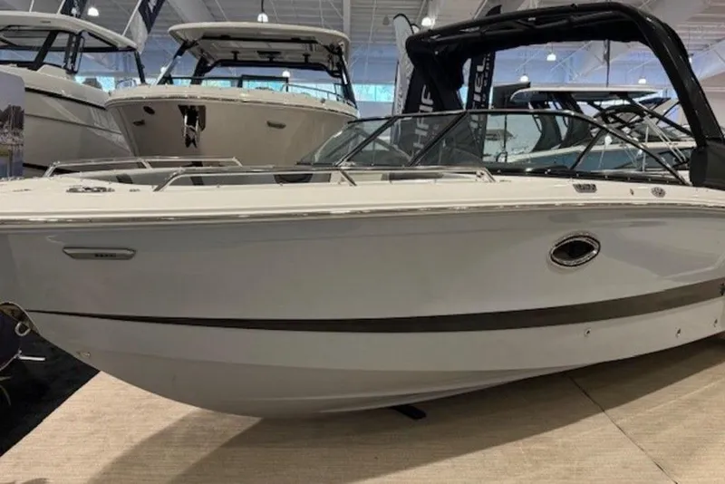 The Image of 2026 Chaparral 270 OSX boat displayed indoors at a showroom. - 1