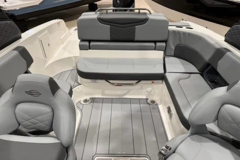Slide: The Image of 2026 Chaparral 270 OSX boat interior with luxurious gray seating and modern design. - 11
