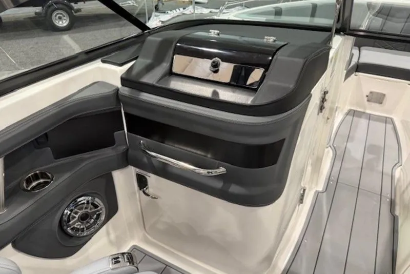 Slide: The Image of 2026 Chaparral 270 OSX boat interior with sleek design and modern amenities. - 14