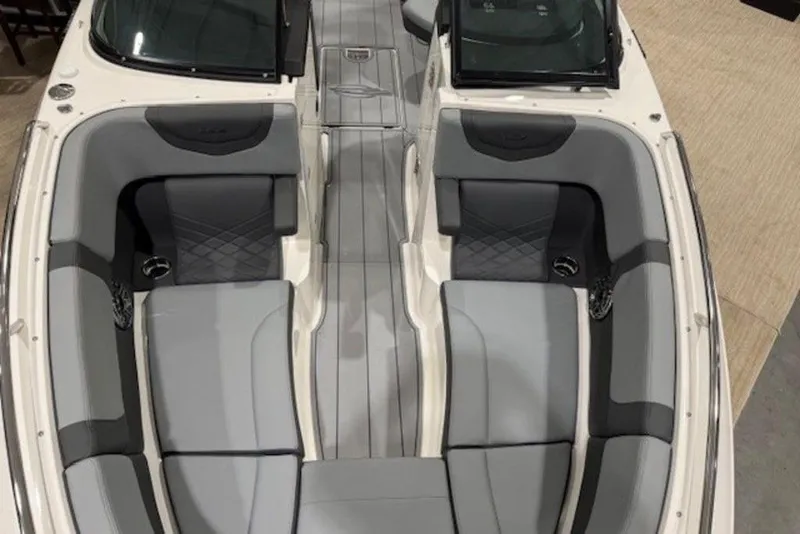 Slide: The Image of 2026 Chaparral 270 OSX boat interior with sleek gray seating and modern design. - 22